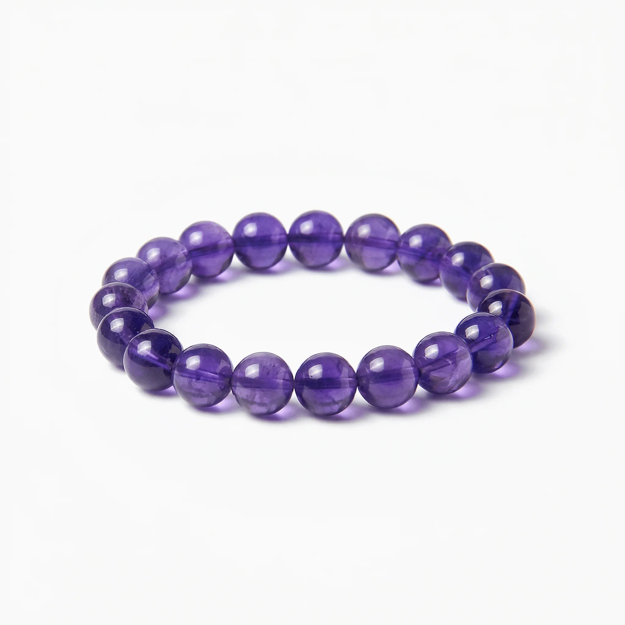 The Amethyst Strand — Bolivian Depth, bracelet on white background BE.