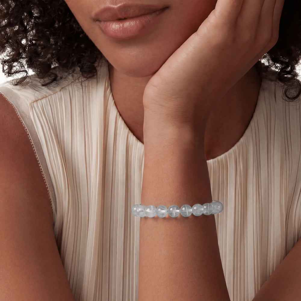 The Blue Needle Strand — Optical Architecture, bracelet on wrist, lifestyle model photo BE.