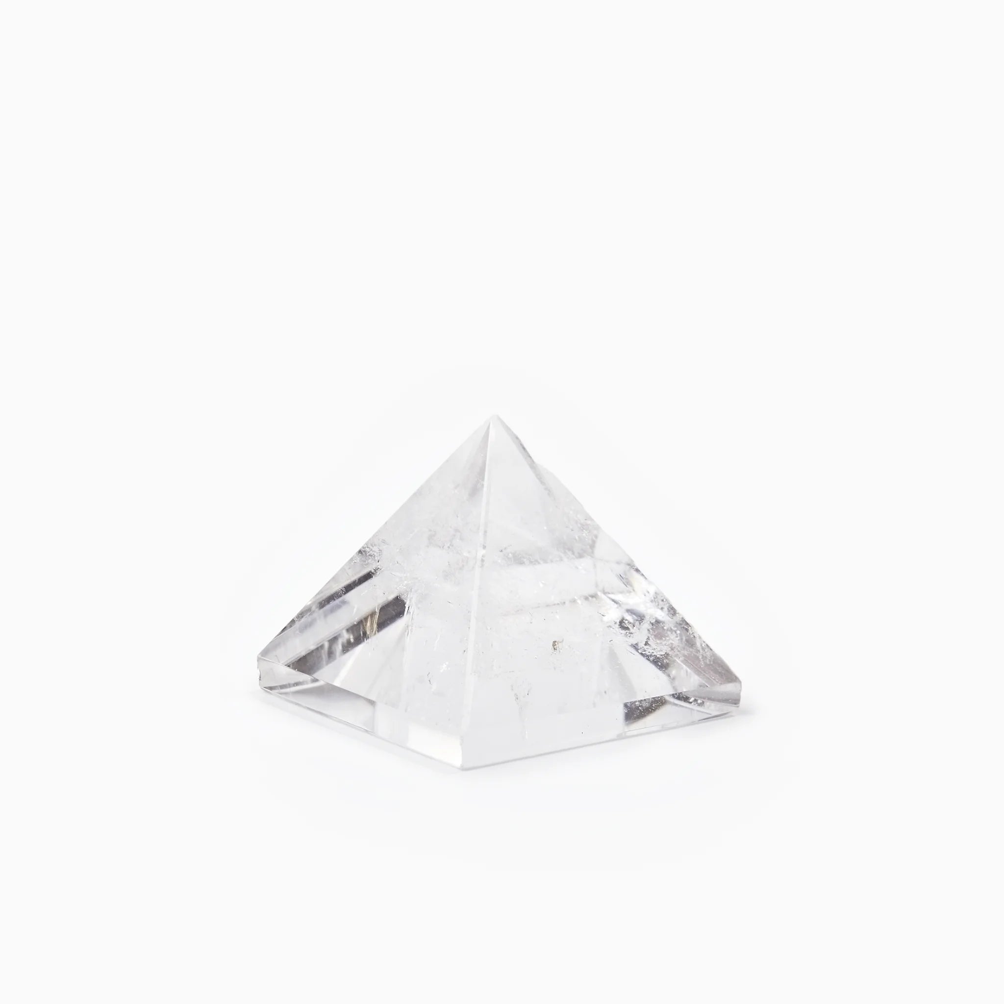 The Clear Quartz Pyramid, crystal pyramid on white background BE.