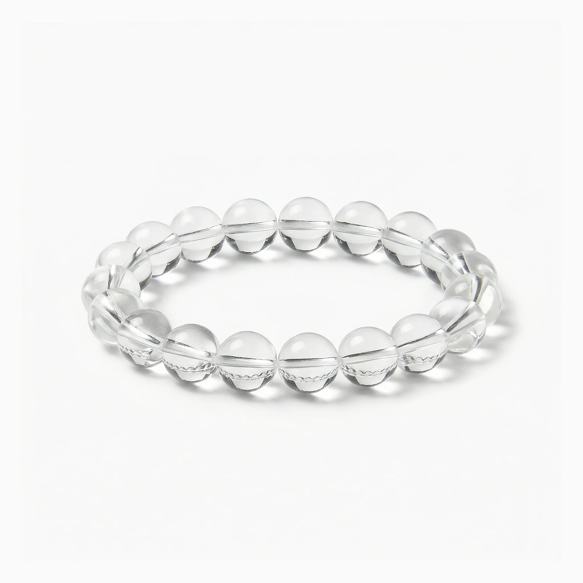 The Clear Quartz Strand — Absolute Clarity, bracelet on white background BE.