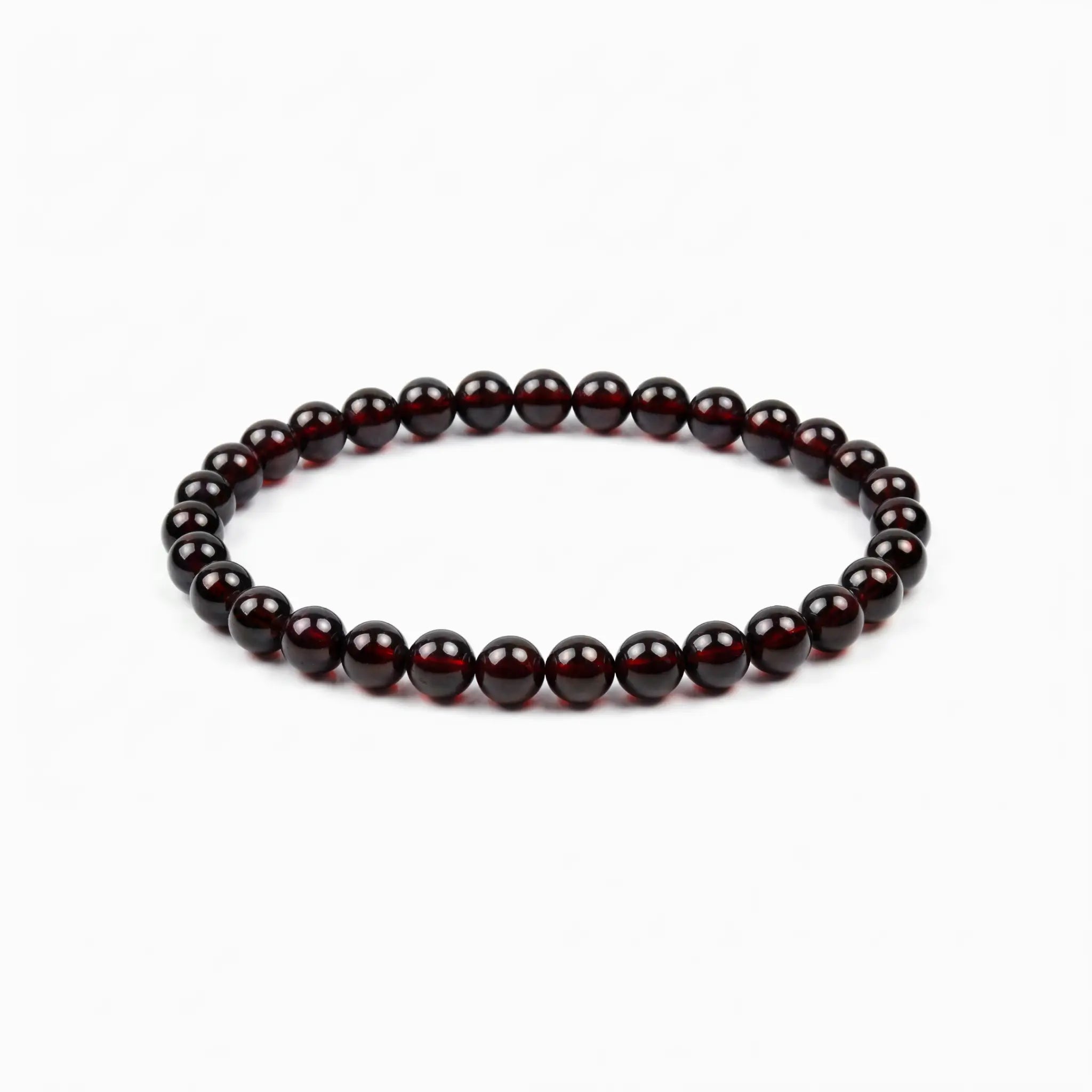 The Garnet Strand — Terrestrial Gravity, bracelet on white background BE.