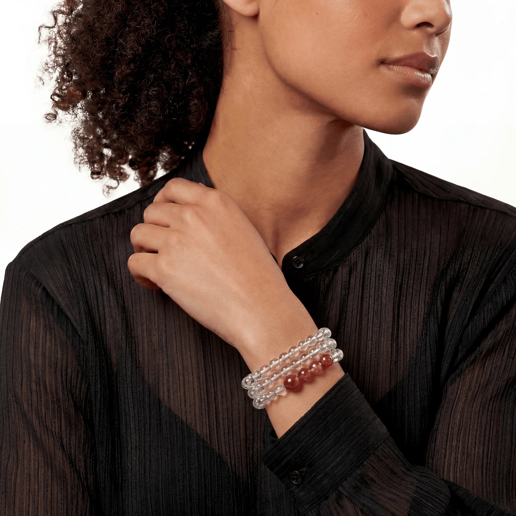 The Hematoid Double Strand — Terrestrial Architecture, bracelet worn on wrist, lifestyle model photo BE.