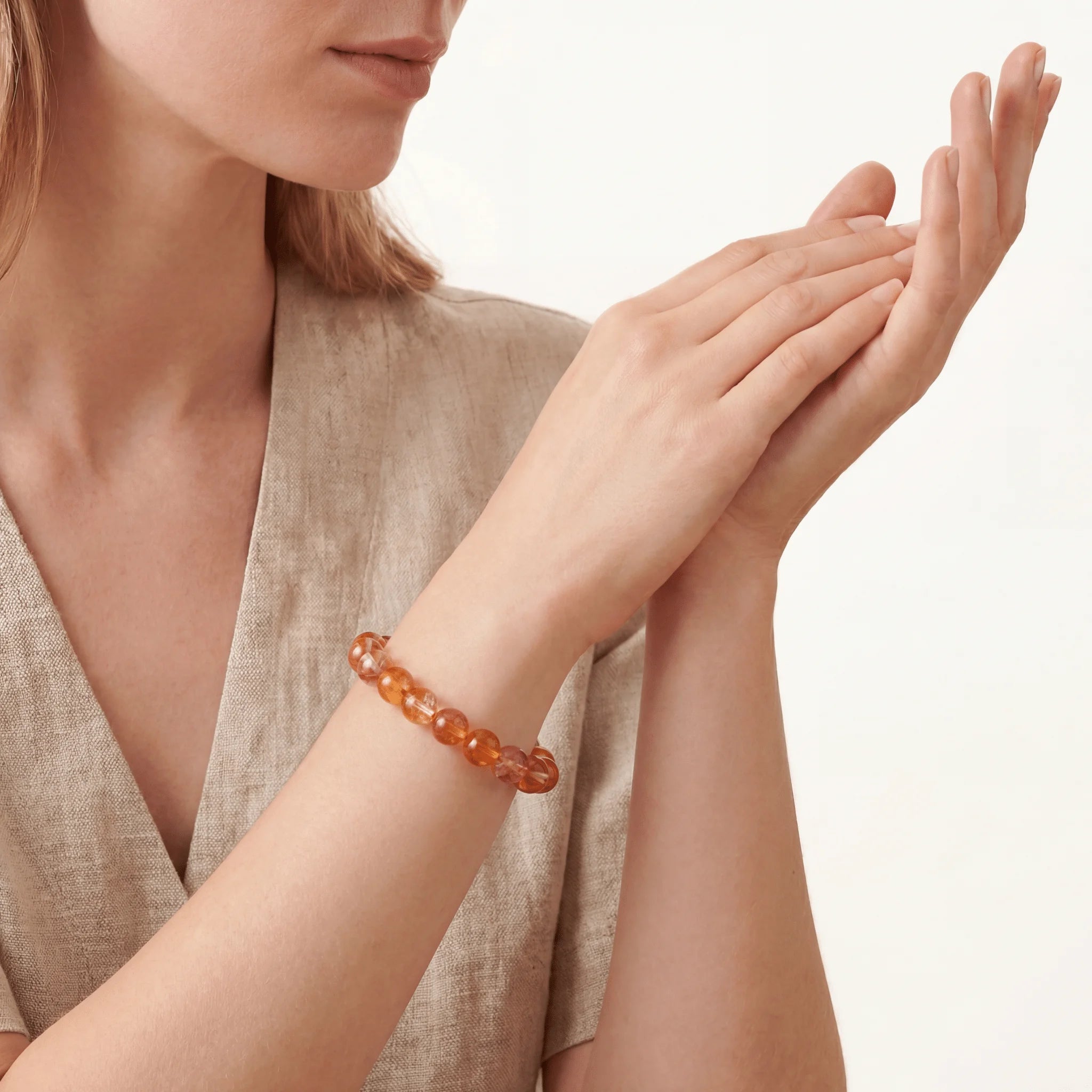 The Hematoid Strand — Iron Pigment, bracelet worn on wrist, lifestyle model photo BE.