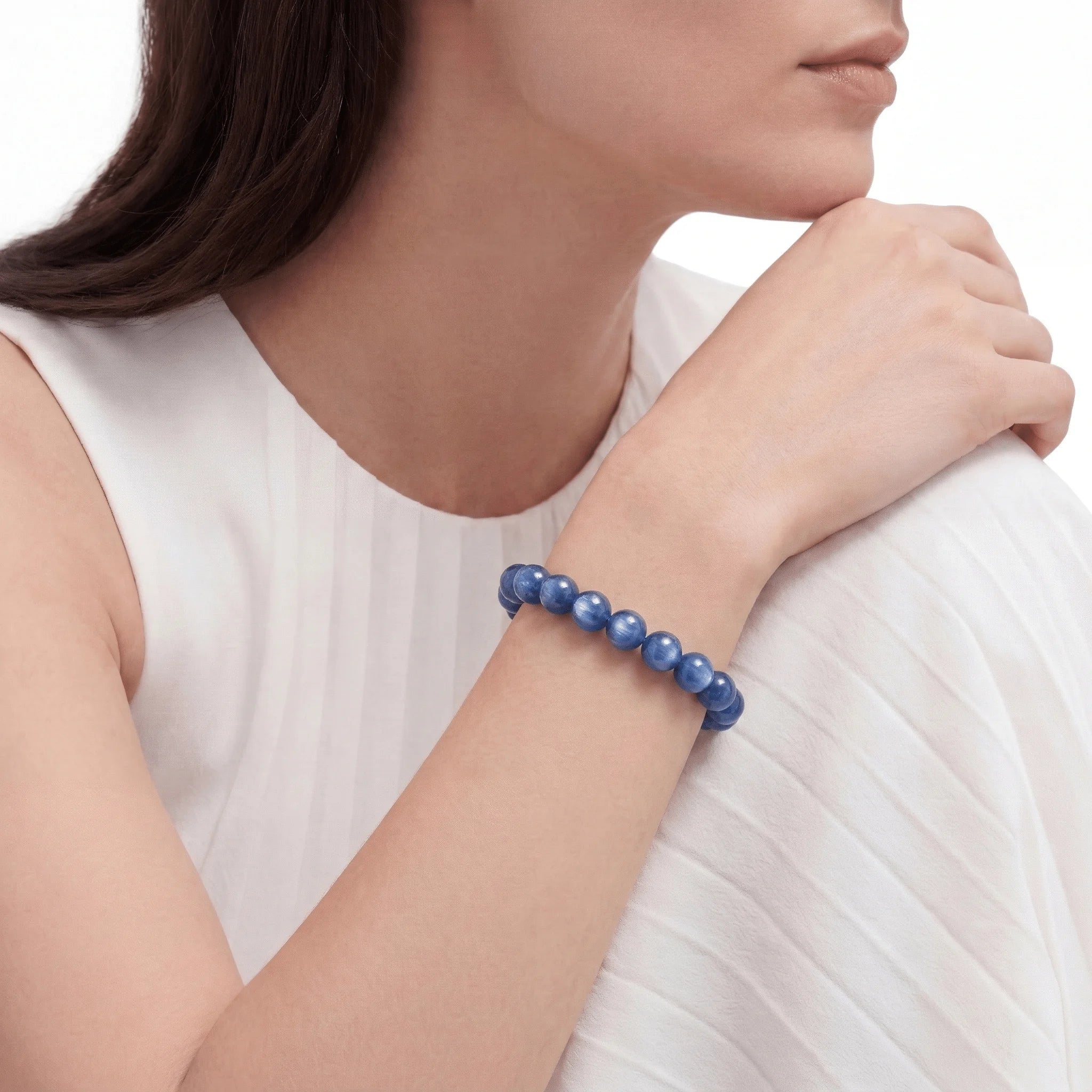 The Kyanite Strand — Directional Alignment, bracelet worn on wrist, lifestyle model photo BE.