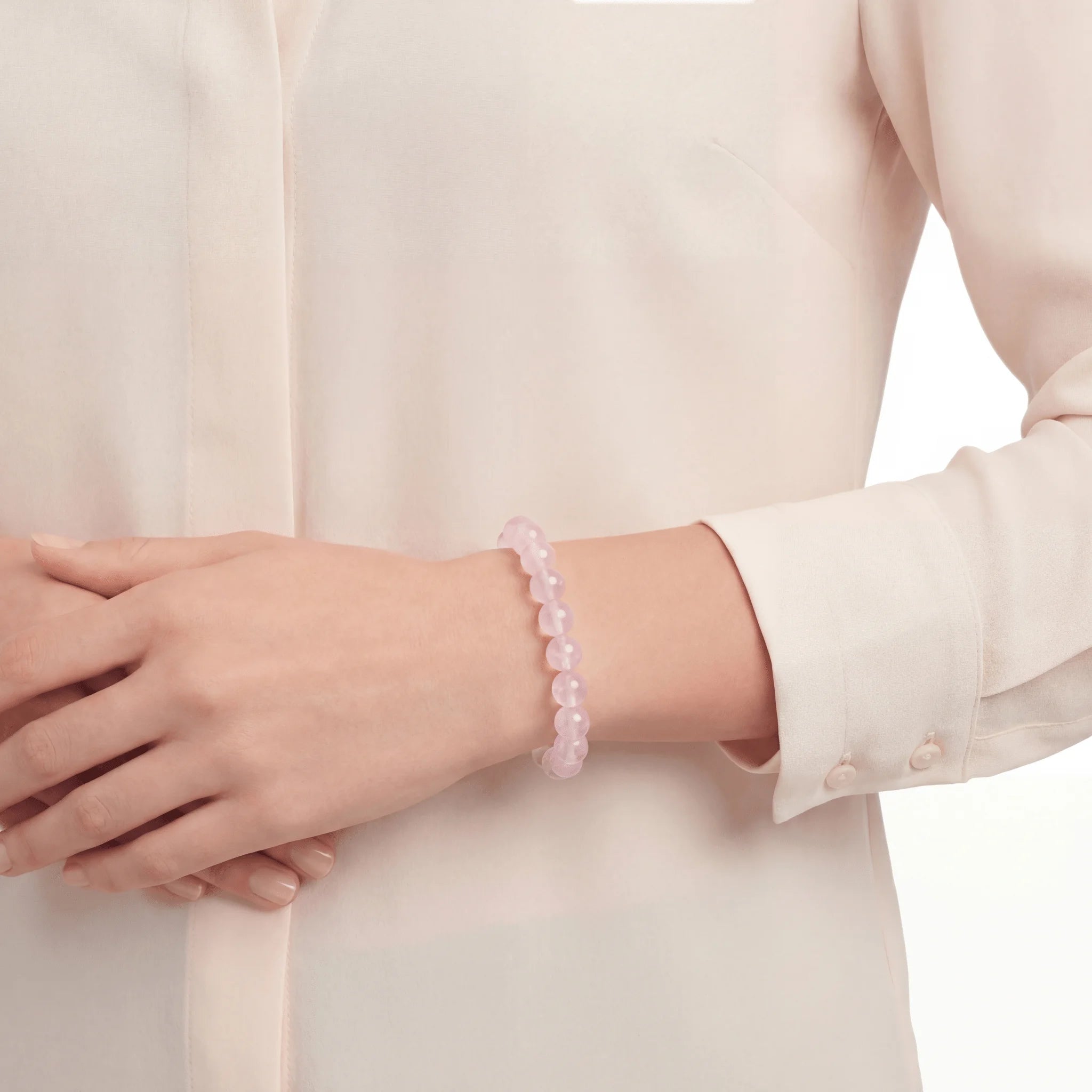 The Rose Quartz Strand — Serene Luminescence, bracelet worn on wrist, lifestyle model photo BE.