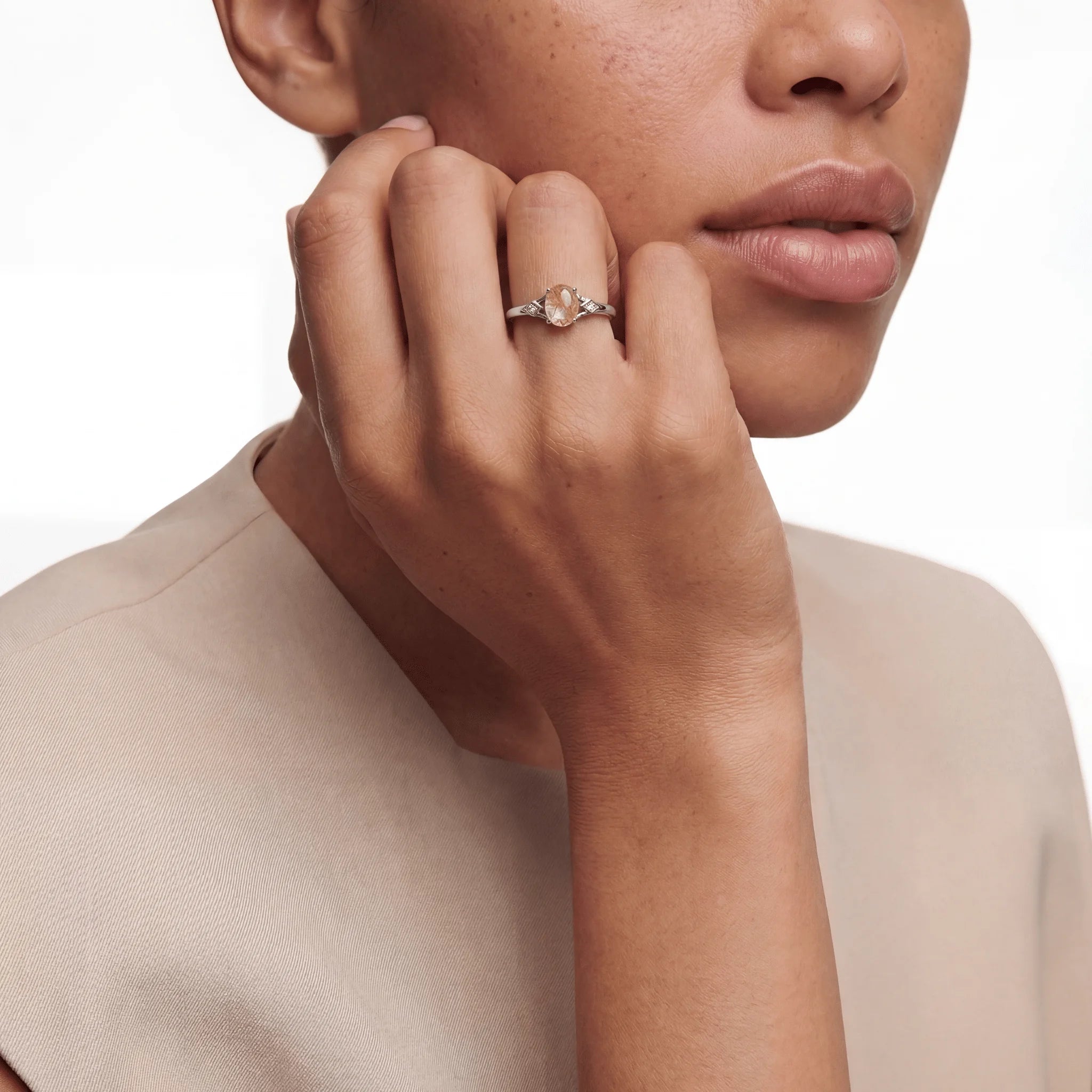 The Rutilated Quartz Integration, ring worn on finger, lifestyle model photo BE.