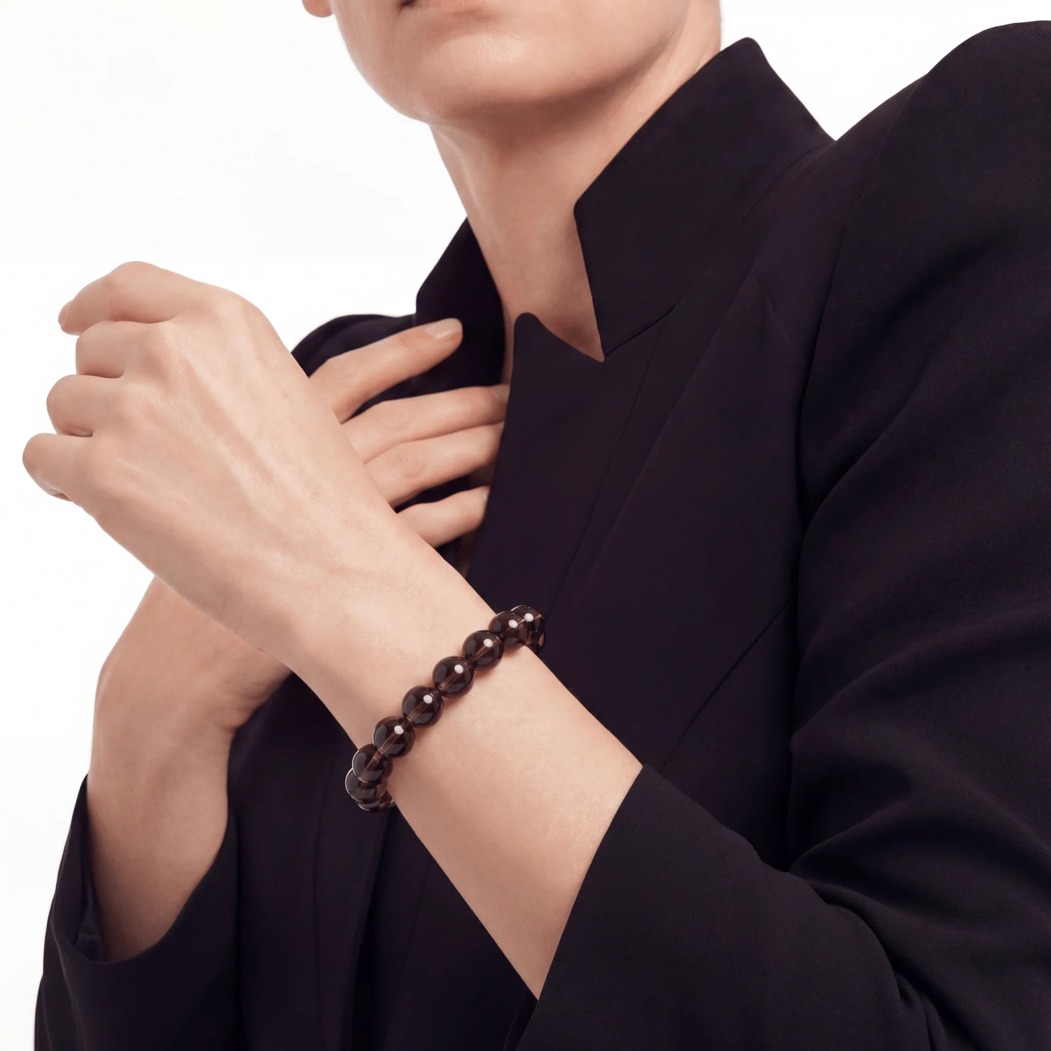 The Smoky Quartz Strand — Terrestrial Shadow, bracelet worn on wrist, lifestyle model photo BE.