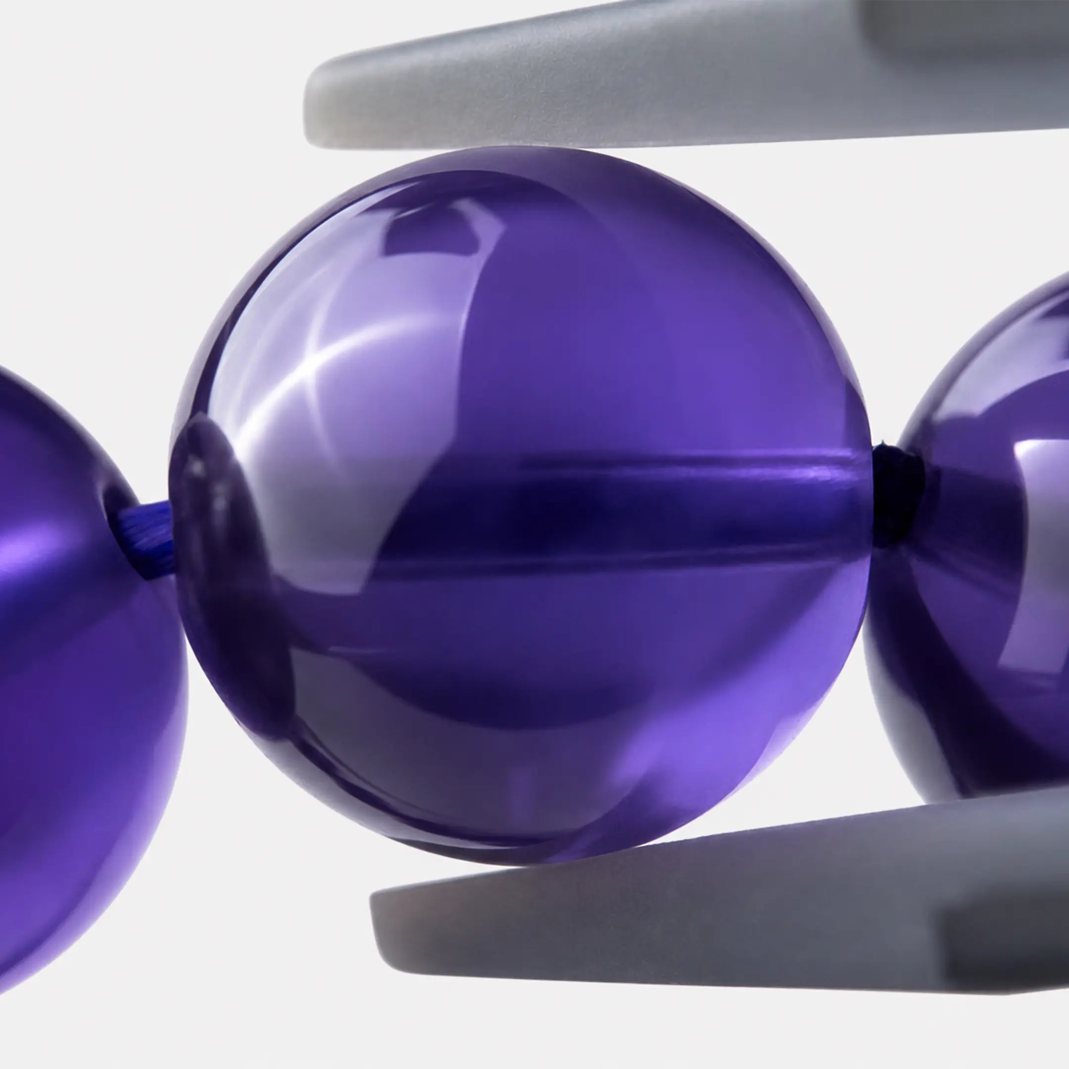 Bolivian Amethyst Bracelet close-up — deep violet colour zoning, angled view, BE.
