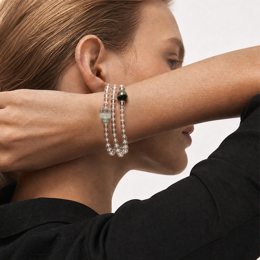 The Emerald Phantom Bracelet - Tri-Wire Architecture worn as a layered wrist structure, BE.
