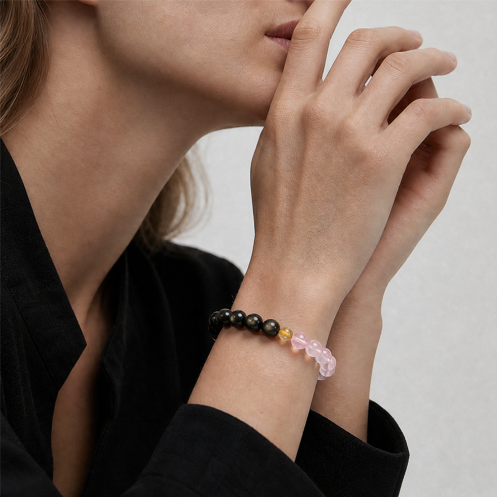 The Obsidian, Pink Quartz and Rutilated Quartz Bracelet close-up on the wrist, BE.