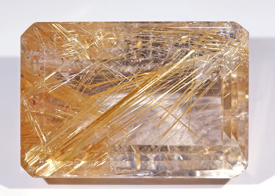 Faceted rutilated quartz with golden rutile needles from Minas Gerais, Brazil