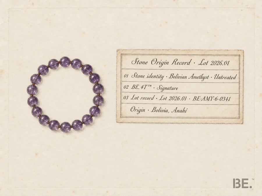 A Stone Origin Record card beside an amethyst bead bracelet, drawn as a mineralogy plate, listing stone identity, BE. 4T tier, lot record and origin