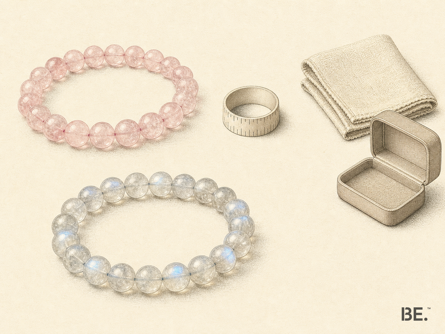 Rose quartz and moonstone bracelets arranged with a soft cloth and an open jewellery box, separating material appearance, fit and care as gift decisions.