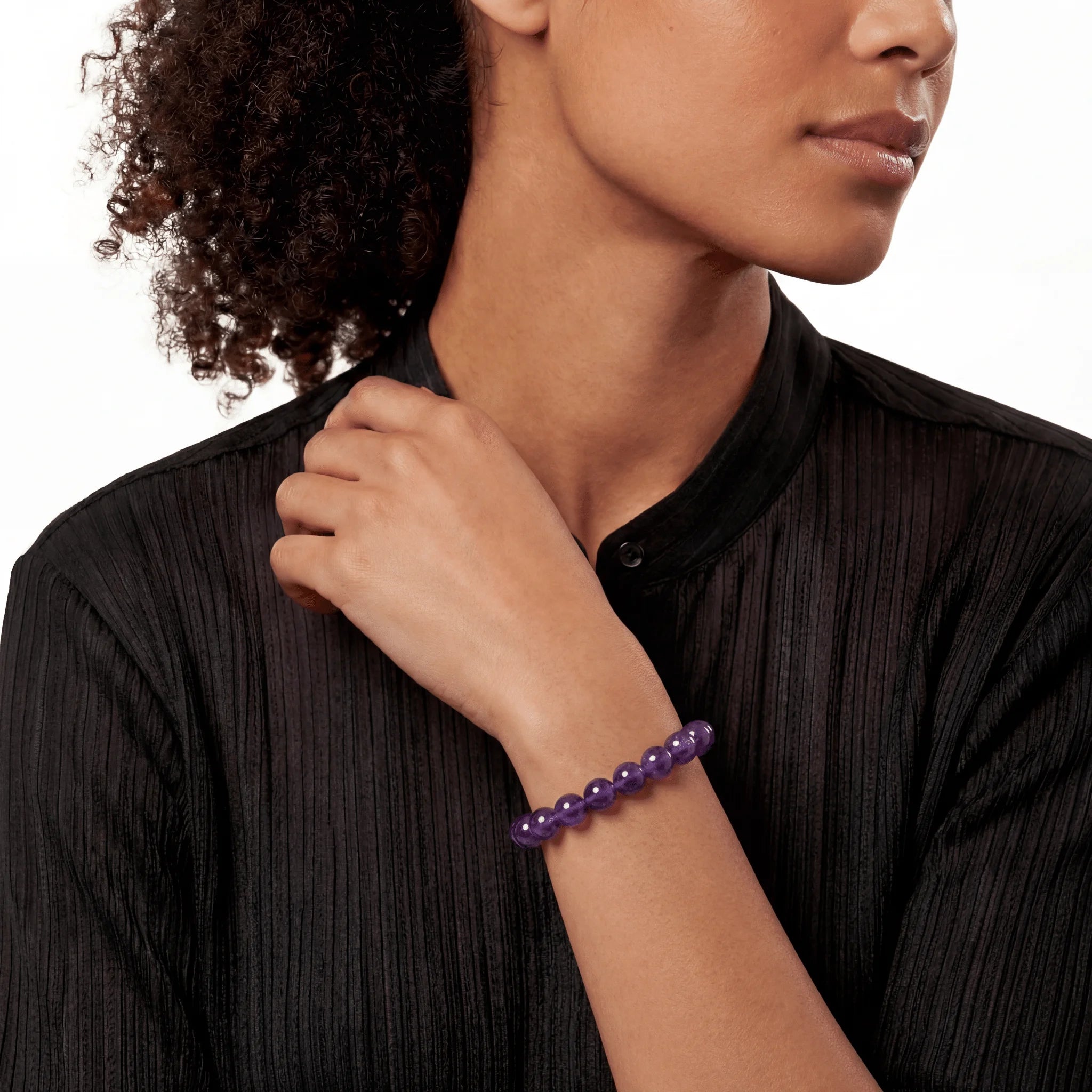 The Amethyst Strand — Bolivian Depth, bracelet on wrist, lifestyle model photo BE.