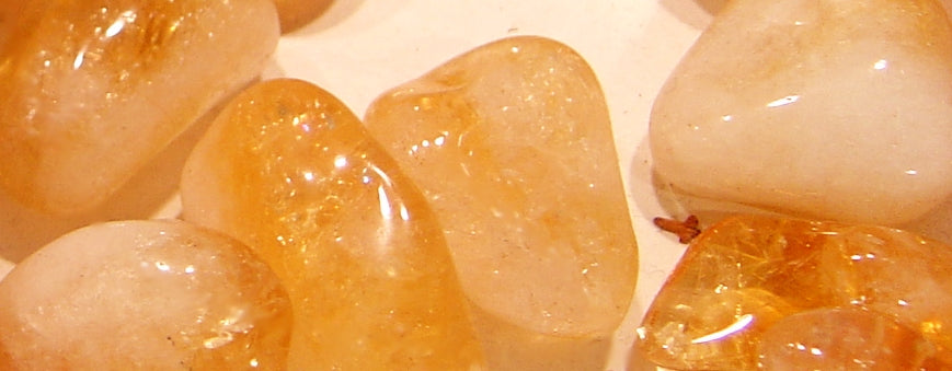 Natural citrine crystal showing transparent yellow-orange colour from iron defects in quartz lattice