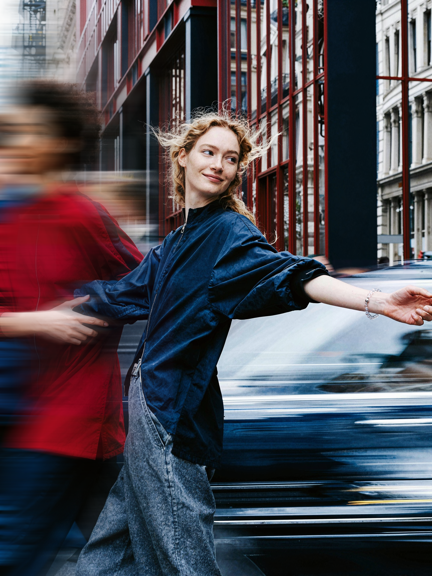 The Flow collection: woman moving through a city street.