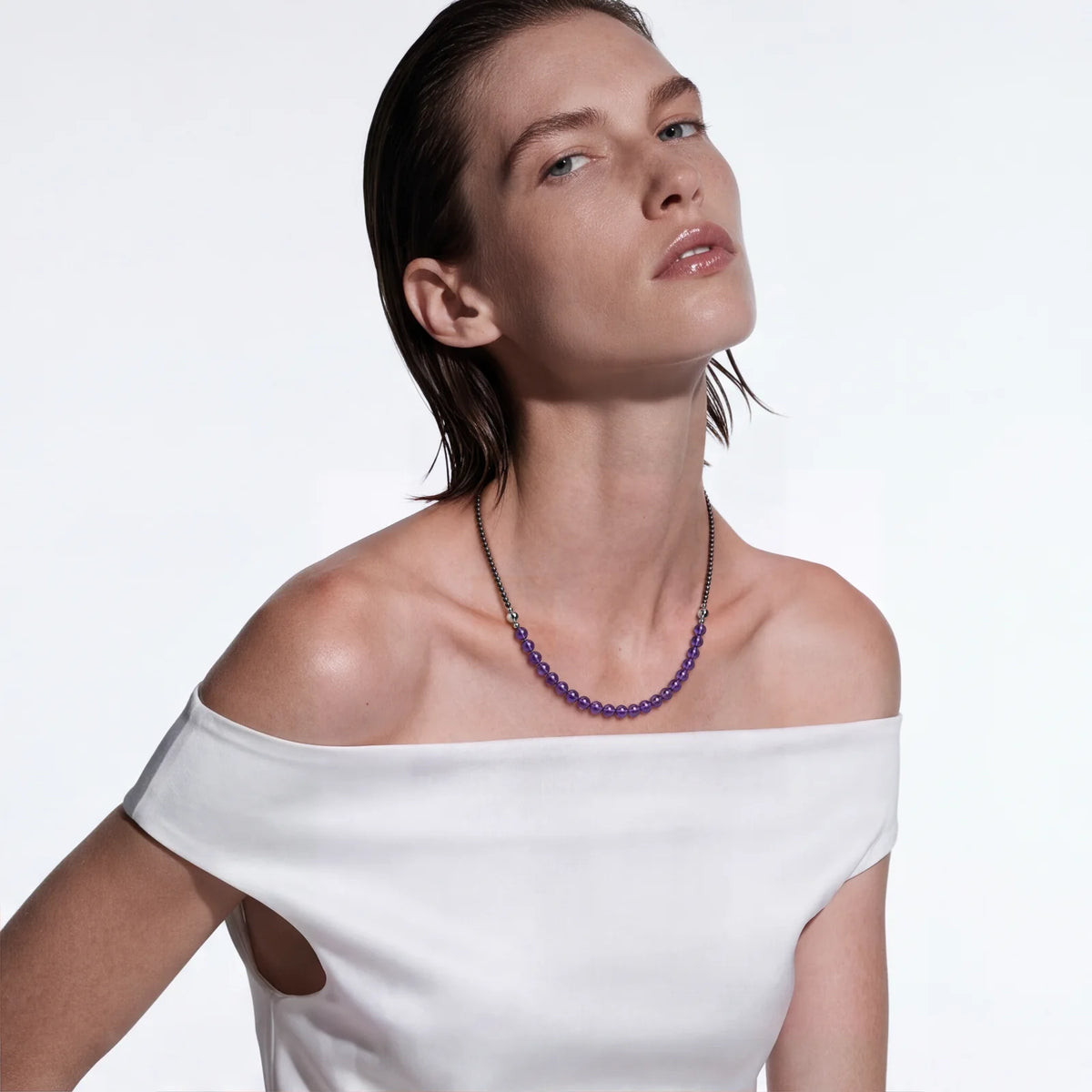 Long: a necklace and a strand joined, worn on the upper chest