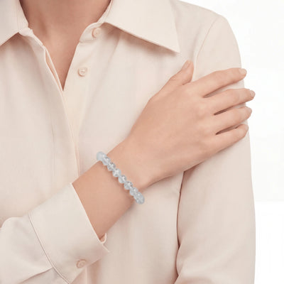 The Blue Needle Strand — Optical Architecture, bracelet worn on wrist, lifestyle model photo BE.