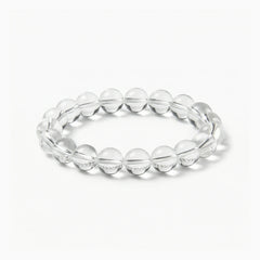 The Clear Quartz Strand — Absolute Clarity, bracelet on white background BE.