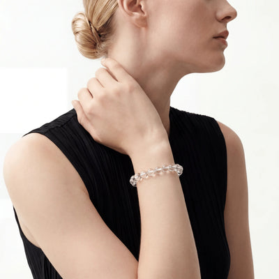The Clear Quartz Strand — Absolute Clarity, bracelet worn on wrist, lifestyle model photo BE.