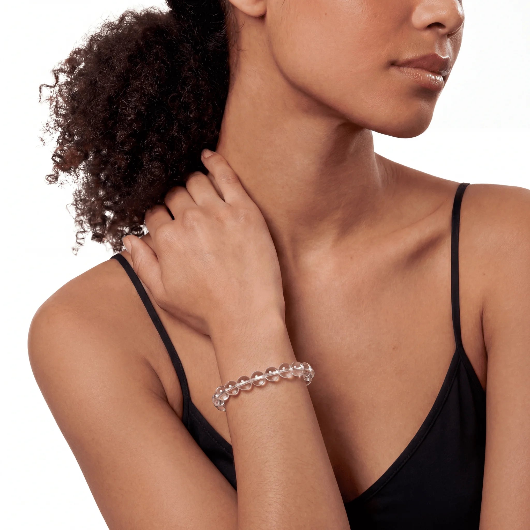 The Clear Quartz Strand — Absolute Clarity, bracelet on wrist, lifestyle model photo BE.