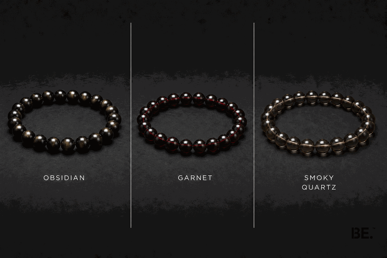 Dark-toned crystal bracelets on a man's wrist — gold sheen obsidian, garnet and smoky quartz strands — BE.