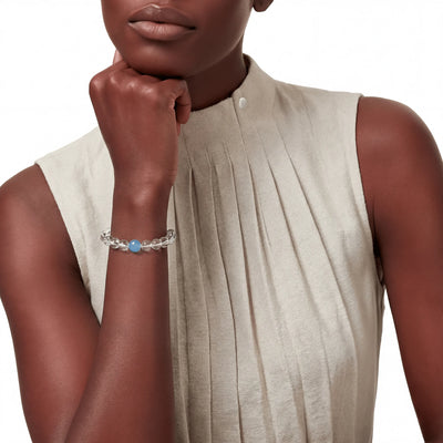 The Dual-Mineral Strand — Oceanic Clarity, bracelet on wrist, lifestyle model photo BE.