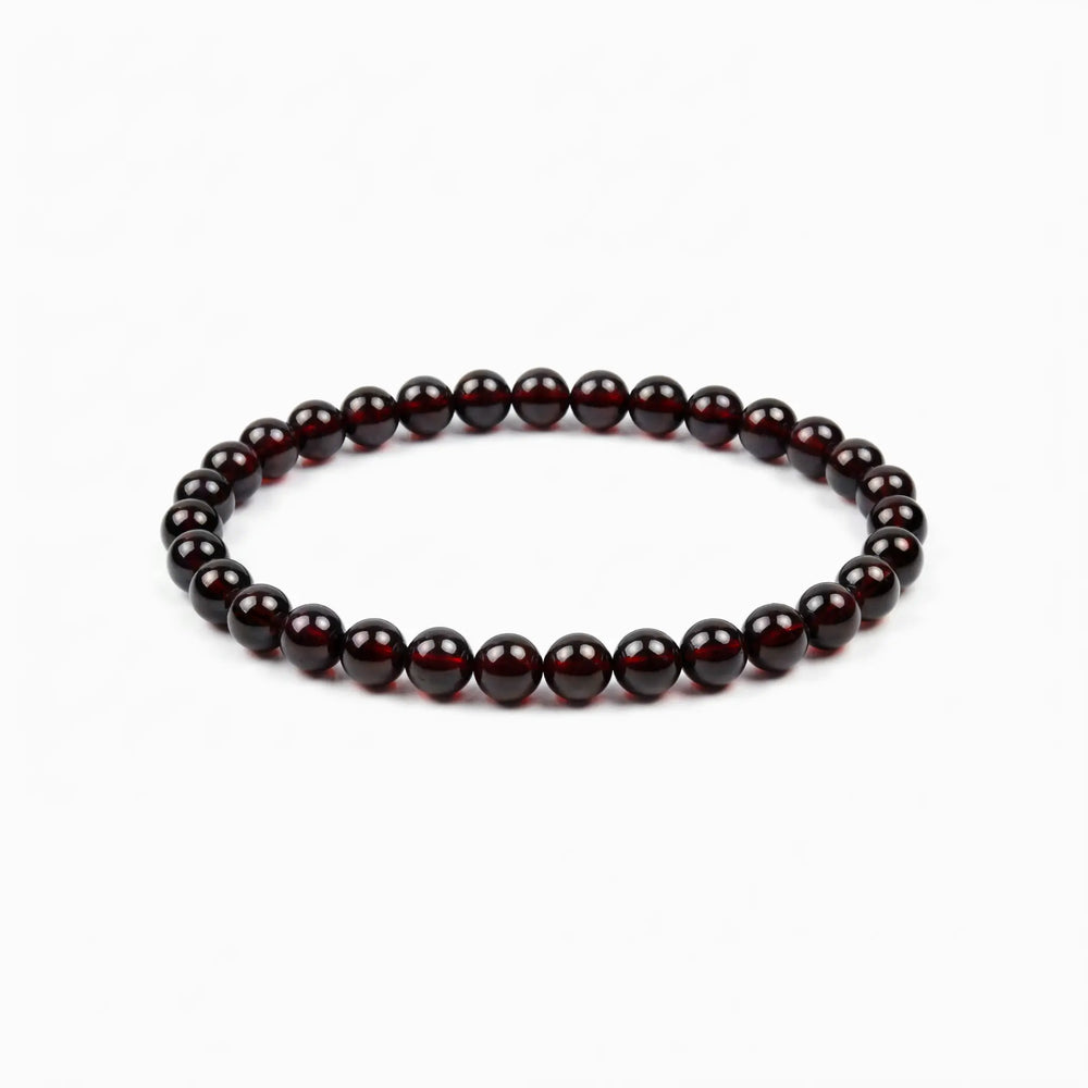 The Garnet Strand — Terrestrial Gravity, bracelet on white background BE.