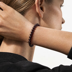 The Garnet Strand — Terrestrial Gravity, bracelet on wrist, lifestyle model photo BE.