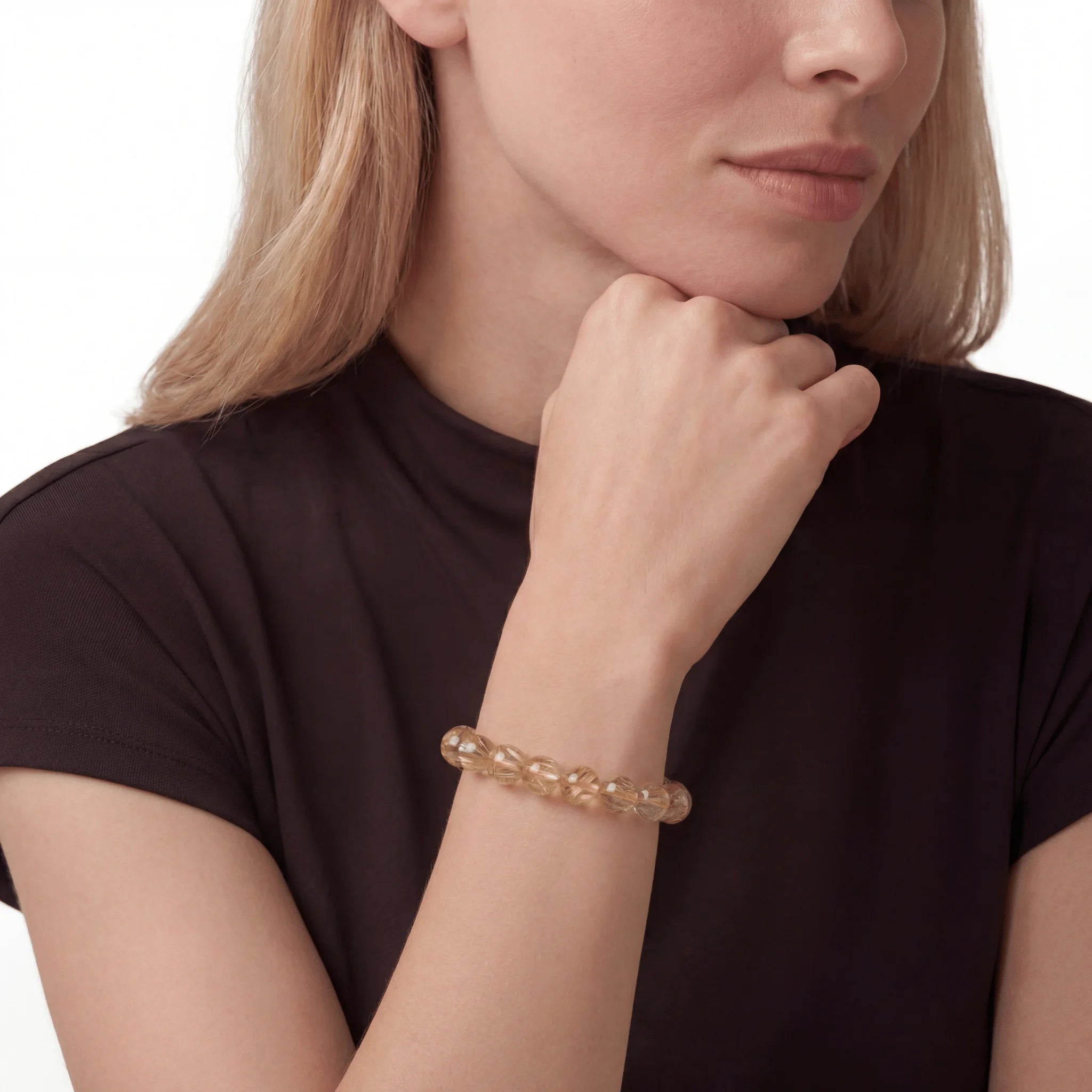Golden Rutilated Quartz Powerflow Bracelet, bracelet worn on wrist, lifestyle model photo BE.