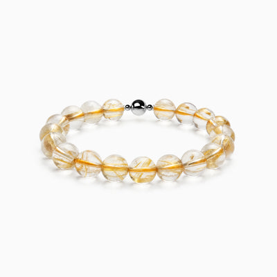Golden Rutilated Quartz Dense Strand Bracelet with magnetic clasp, product image on a white background.