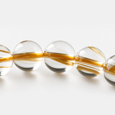 Golden Rutilated Quartz Bracelet close-up — fine golden rutile threads in clear quartz, BE.