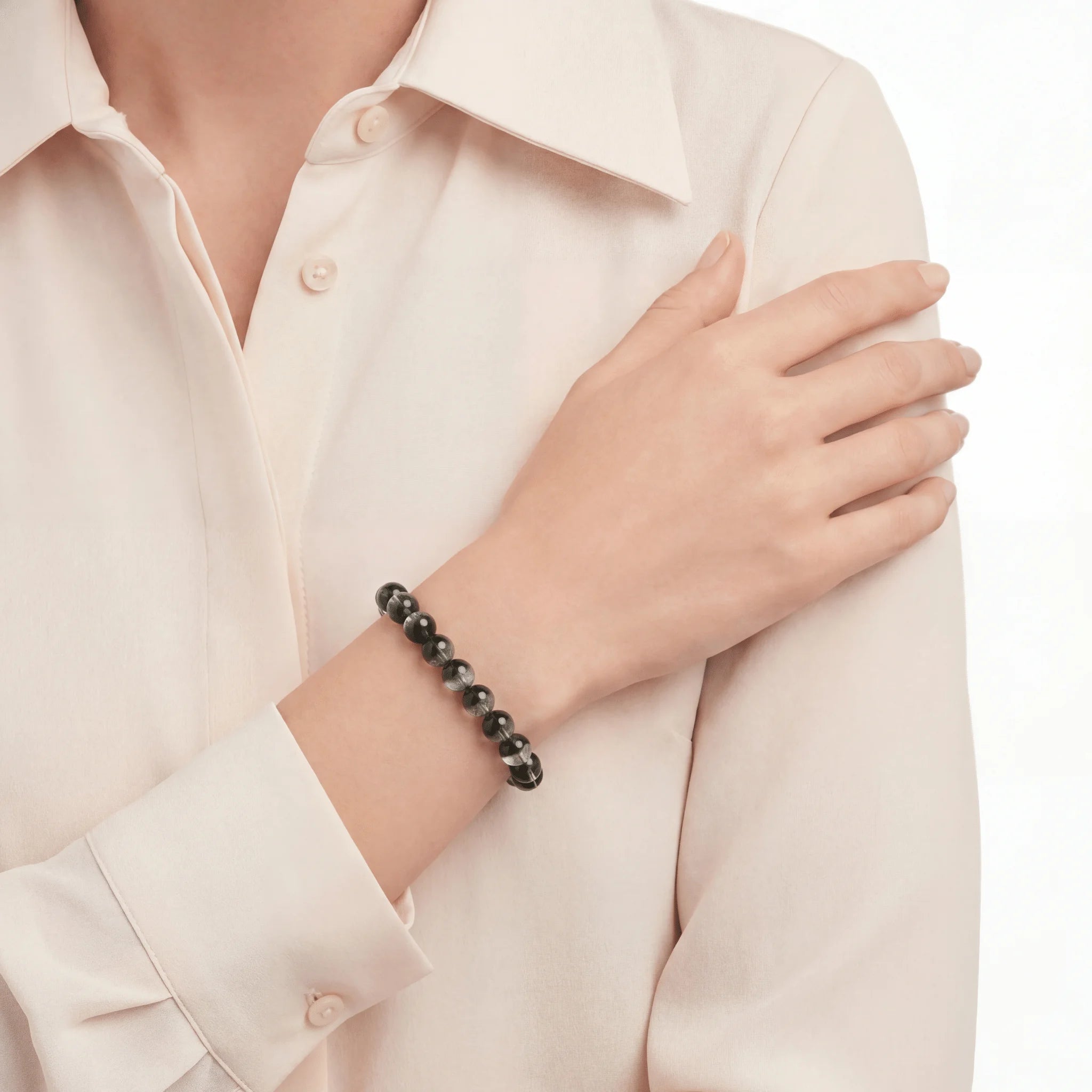 The Green Phantom Strand — Geological Sequence, bracelet on wrist, lifestyle model photo BE.