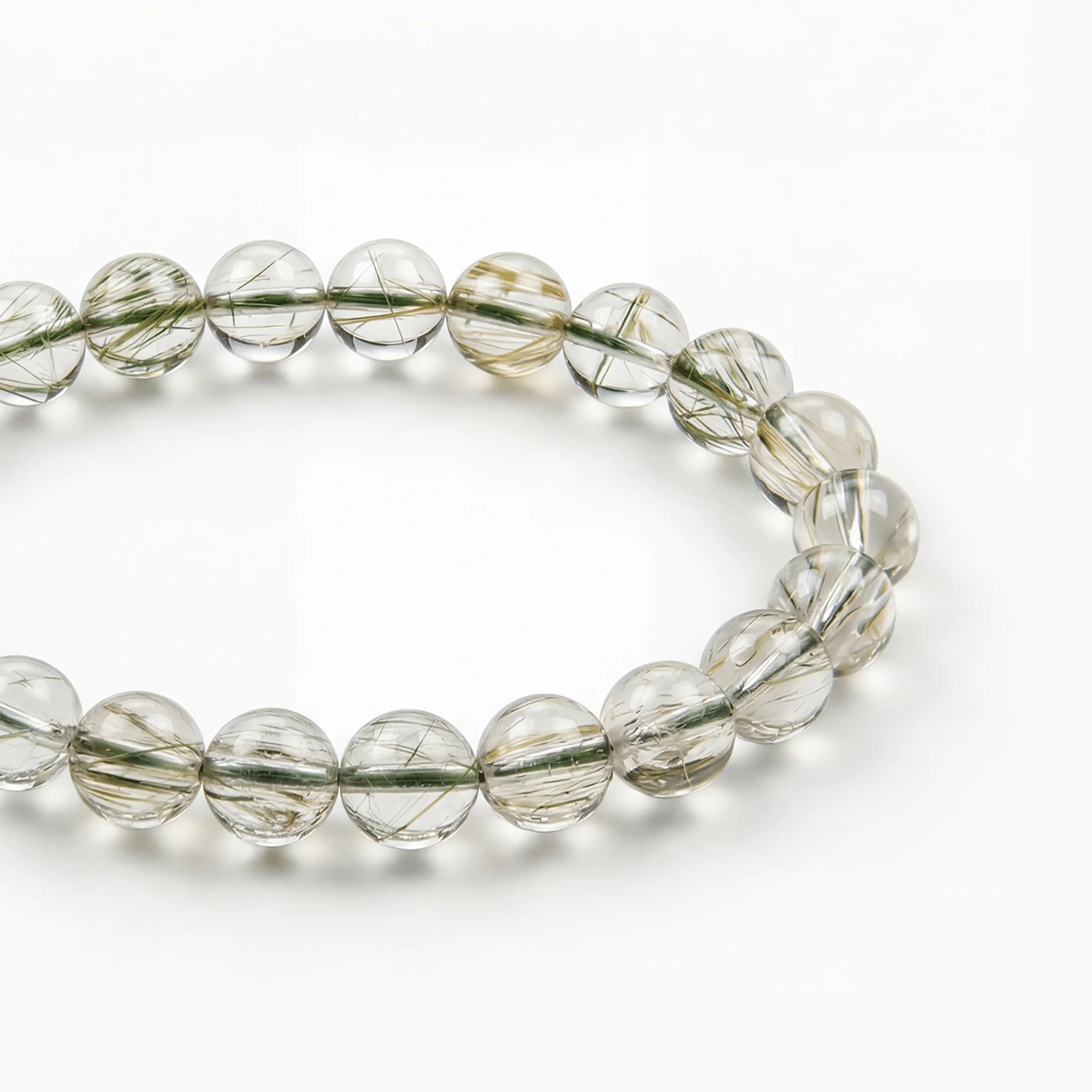 The Green Rutile Strand — Mineral Suspension, bracelet detail view BE.