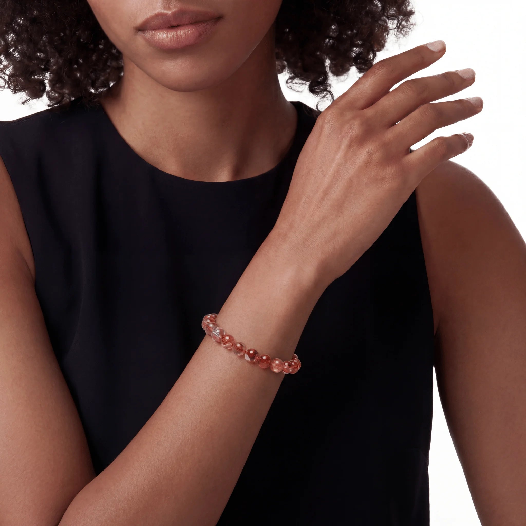 The Hematoid Sequence — Iron Oxide, bracelet on wrist, lifestyle model photo BE.