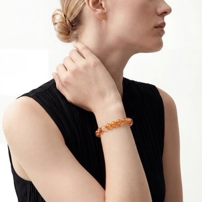 The Hematoid Strand — Iron Pigment, bracelet on wrist, lifestyle model photo BE.