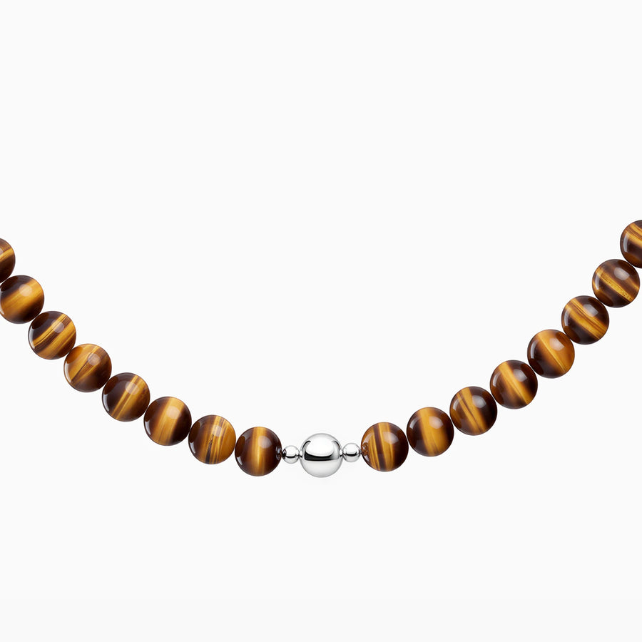 Golden tiger’s eye 8mm necklace, close-up of polished beads and the silver-coloured magnetic clasp.
