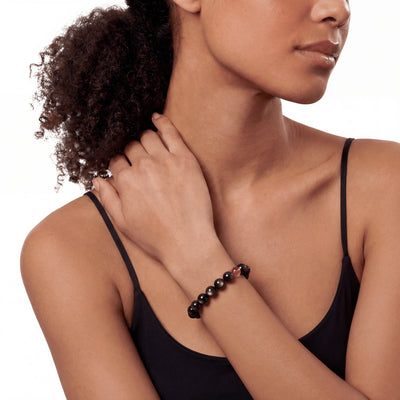 The Obsidian Strand — Iron Hemisphere, bracelet worn on wrist, lifestyle model photo BE.