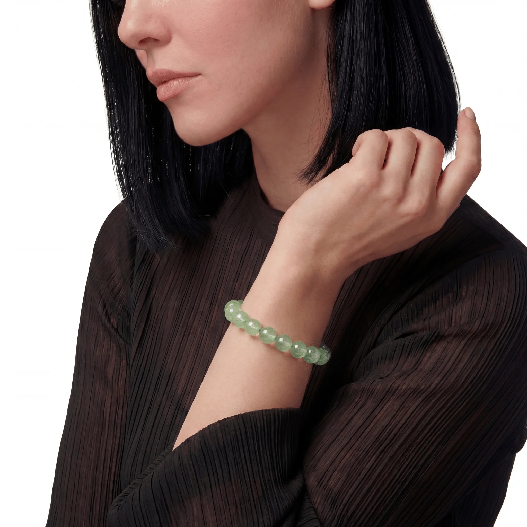 The Prehnite Strand — Luminous Matrix, bracelet on wrist, lifestyle model photo BE.