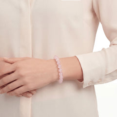 The Rose Quartz Strand — Serene Luminescence, bracelet worn on wrist, lifestyle model photo BE.