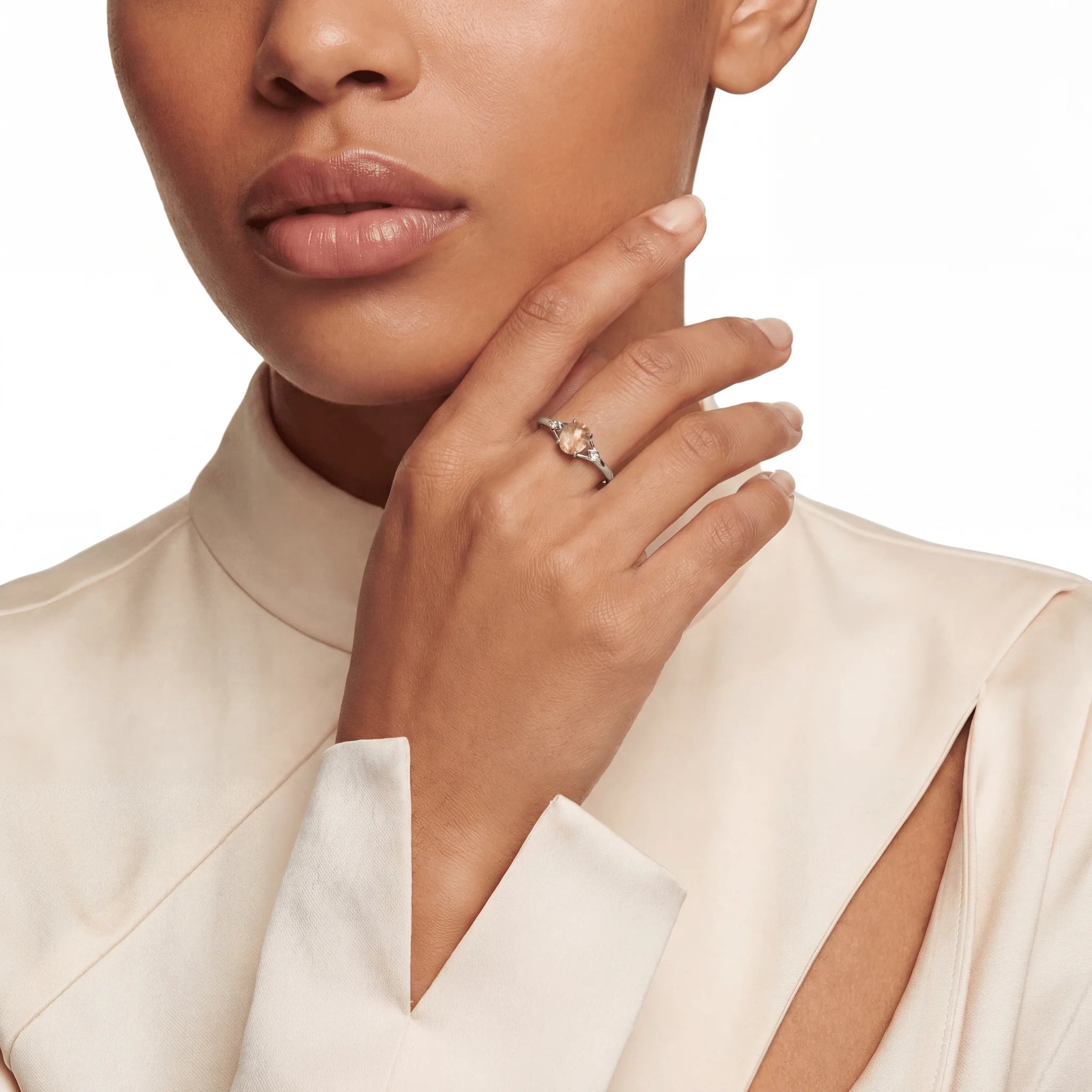 The Rutilated Quartz Integration, ring on finger, lifestyle model photo BE.