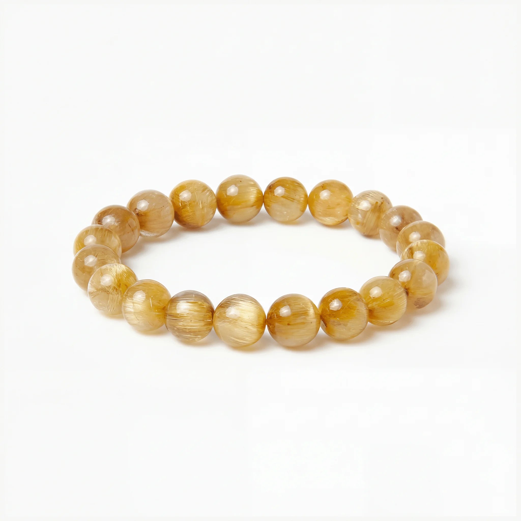 The Rutilated Quartz Strand — Golden Array, bracelet on white background BE.
