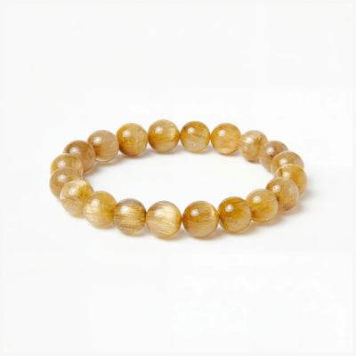 The Rutilated Quartz Strand — Golden Array, bracelet on white background BE.