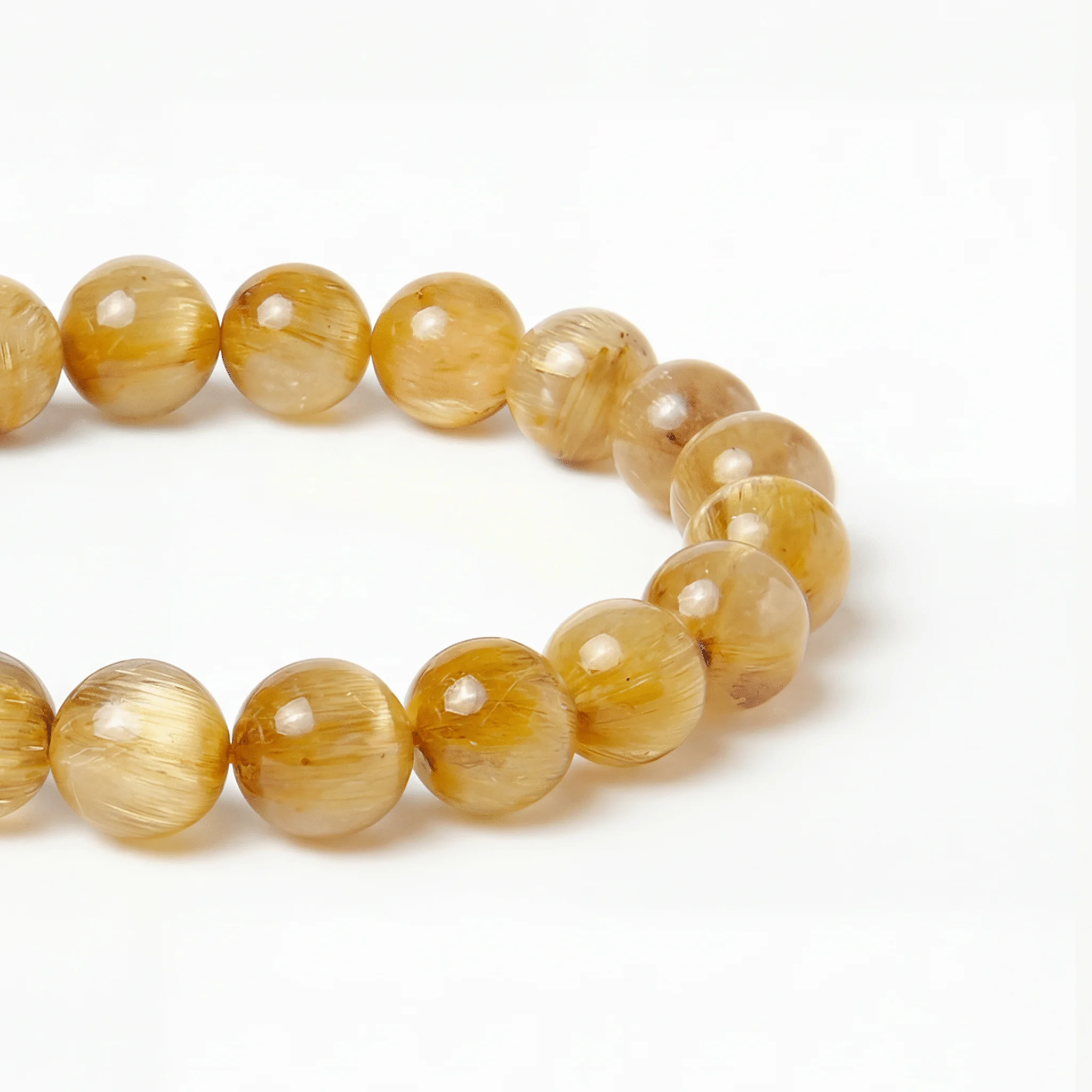 The Rutilated Quartz Strand — Golden Array, bracelet detail view BE.