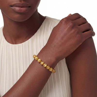 The Rutilated Quartz Strand — Golden Array, bracelet worn on wrist, lifestyle model photo BE.