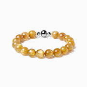 BE. Golden Rutilated Quartz clear strand bracelet with round magnetic clasp