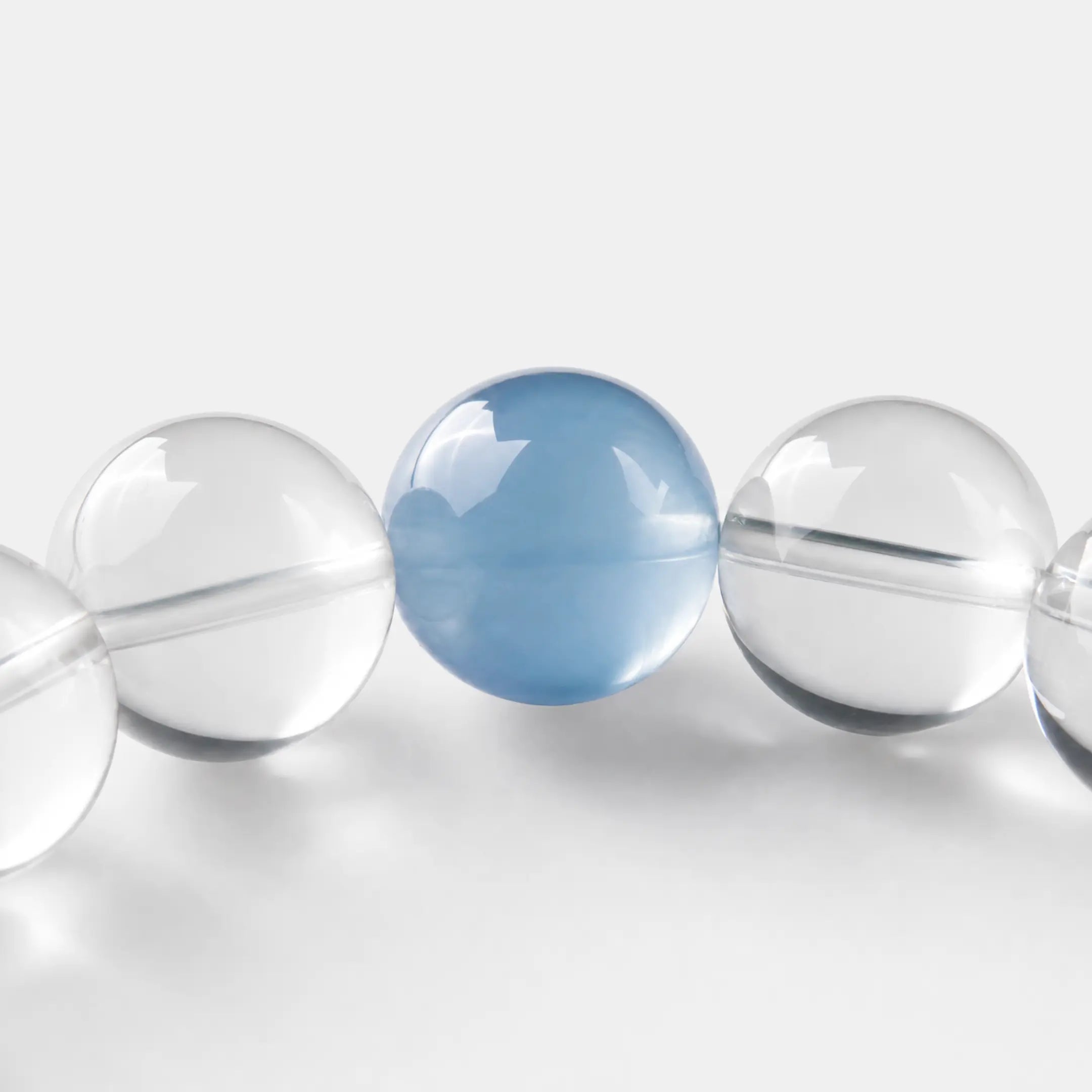 Clear Quartz & Aquamarine Bracelet close-up — pale aquamarine beside clear quartz, BE.