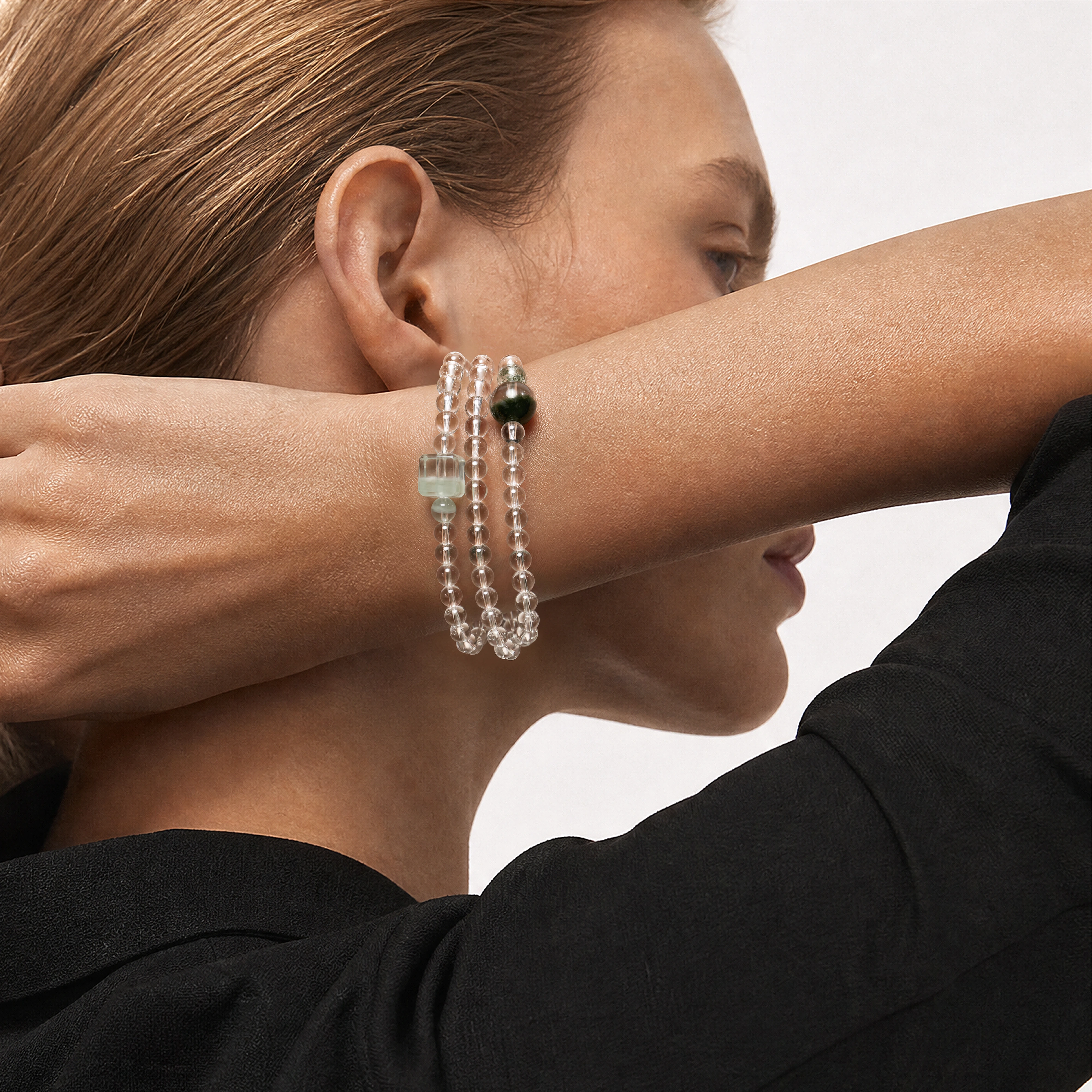 The Emerald Phantom Bracelet - Tri-Wire Architecture worn as a layered wrist structure, BE.