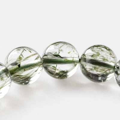 Green Rutilated Quartz Bracelet close-up — fine green mineral needles suspended in clear quartz, BE.